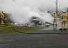 Members of the NI Fire and Rescue Service tackle a fire which broke out among rubbish in an ABC Council bin lorry.
