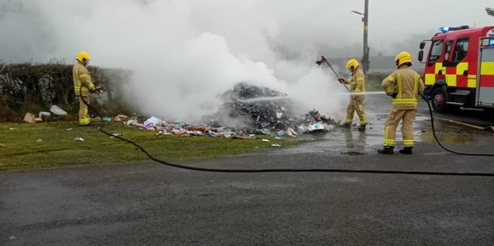 Bin Lorry Fire 2 Members of the NI Fire and Rescue Service tackle a fire which broke out among rubbish in an ABC Council bin lorry.