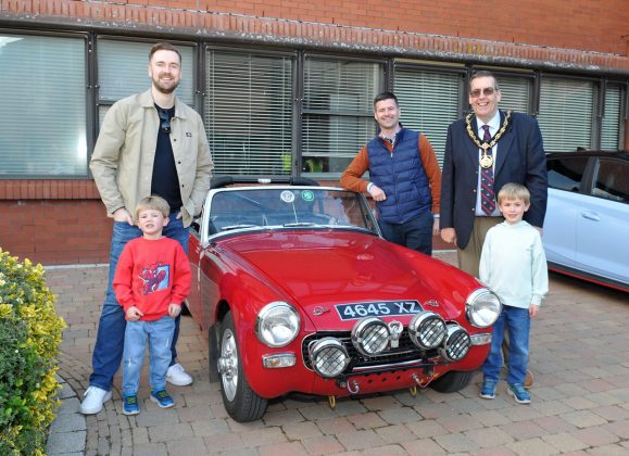 Lord Mayor of Armagh City, Banbridge and Craigavon, Alderman Stephen Moutray at his Cars, Bikes and Coffee charity evening at Craigavon Civic Centre with his son Councillor Kyle Moutray, grandsons, Gabriele and Nathaniel Totten and Jonathan Buckley, MLA.
