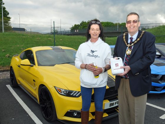 Lisa Doherty receives a prize for her Ford Mustang from Lord Mayor, Alderman Stephen Moutray.