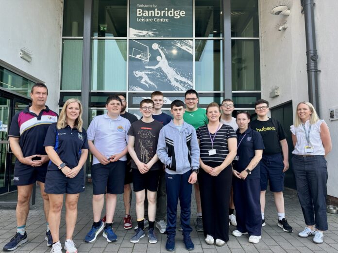 A group of people standing in front of Banbridge Leisure Centre