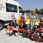 Water safety and drowning prevention day at South Lake Watersports two rescue crew members and two swimming instructors are pictured with the lord mayor beside the Lough Neagh Search and Rescue van.