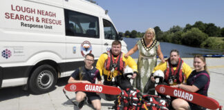 Water safety and drowning prevention day at South Lake Watersports two rescue crew members and two swimming instructors are pictured with the lord mayor beside the Lough Neagh Search and Rescue van.