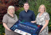 Building a stronger, connected borough through the Digital Future Programme Three people holding a board promoting the new Digital Future Programme
