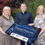 Three people holding a board promoting the new Digital Future Programme