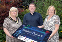 Building a stronger, connected borough through the Digital Future Programme Three people holding a board promoting the new Digital Future Programme