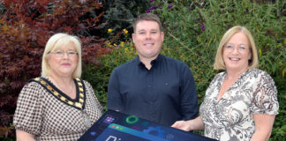 Building a stronger, connected borough through the Digital Future Programme Three people holding a board promoting the new Digital Future Programme