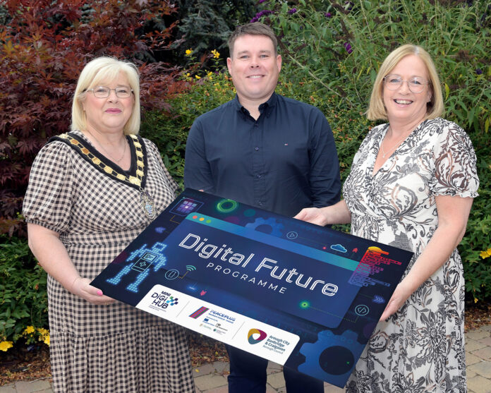 Three people holding a board promoting the new Digital Future Programme