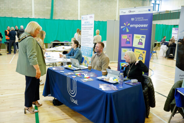People talking at a job fair