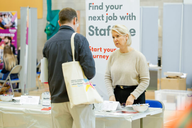 People talking at a job fair