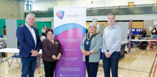 Job Fair connects jobseekers with local opportunities in Banbridge People standing together at a job fair, looking at the camera