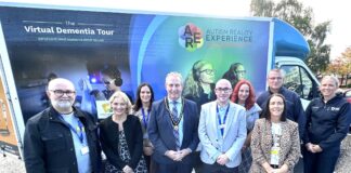 Dementia and autism bus delivers powerful experience in Tandragee Deputy Lord Mayor, Alderman Lavelle McIlrath pictured with organisers of the Health and Wellbeing event held in Tandragee for Positive Ageing Month.